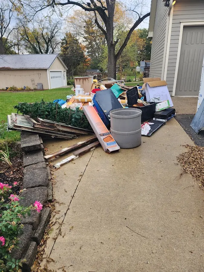 Dumpster being loaded with debris for 3 Yard Dumpster Rental in Fredericksburg